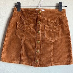 Corduroy button down skirt with gold buttons.
